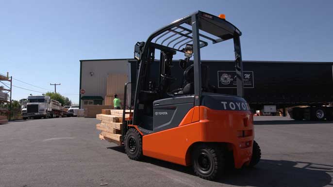 Toyota Forklift carrying wooden freight outside