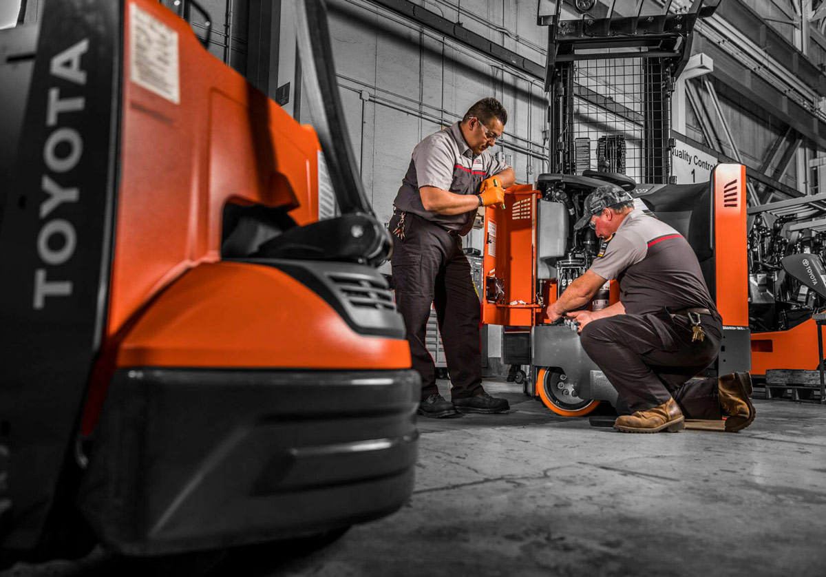 Toyota Service Technicians Servicing Forklift