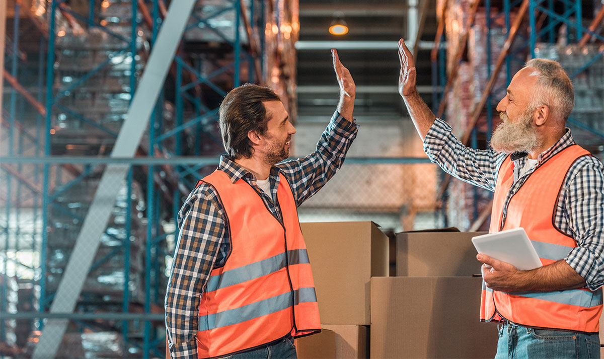 Warehouse Workers Giving a High-Five